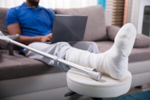 black-man-with-broken-leg-in-a-cast