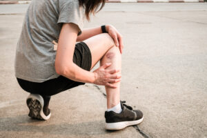 injured runner in a parking lot
