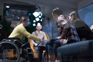 woman in a wheelchair at a meeting
