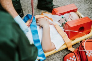 child receiving treatment on a stretcher