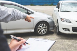 insurance agent filling out a car accident report