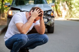 man stressed after a head-on crash