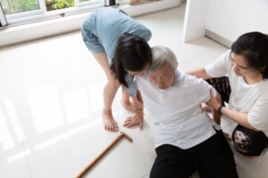 old woman falling on the floor