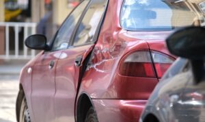 red-car-with-hit-and-run-damage
