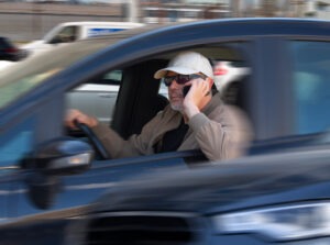man-speeding-while-on-the-phone