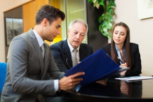 businesspeople with their attorney
