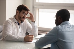 man-talking-to-his-attorney