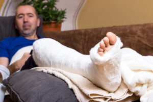 man with broken foot