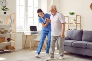 nurse-helping-man-in-nursing-home