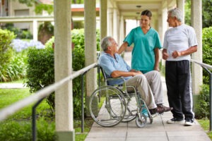 senior citizen talking to nurse in nursing home