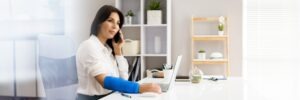 woman in a cast on the phone