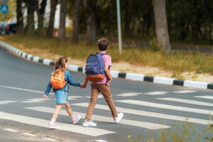 kids walking in a crosswalk