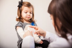 little girl getting a cast put on