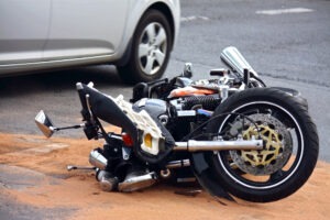 crunched-up motorcycle on road