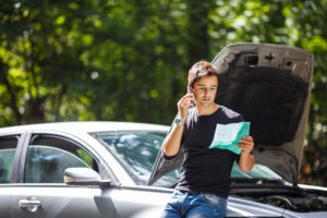 man on the phone reporting car accident