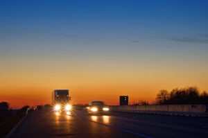 tractor-trailer following a car