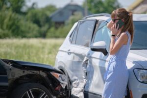 woman on phone after a crash