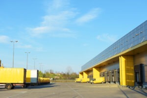 DHL trucks in a parking lot